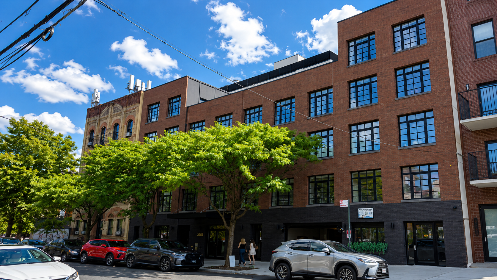Multi-story brick condominium on a Brooklyn street